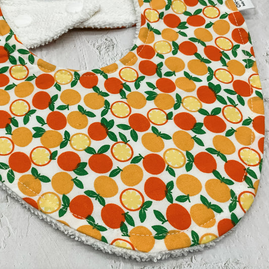 Squeeze The Day Orange Signature Bib