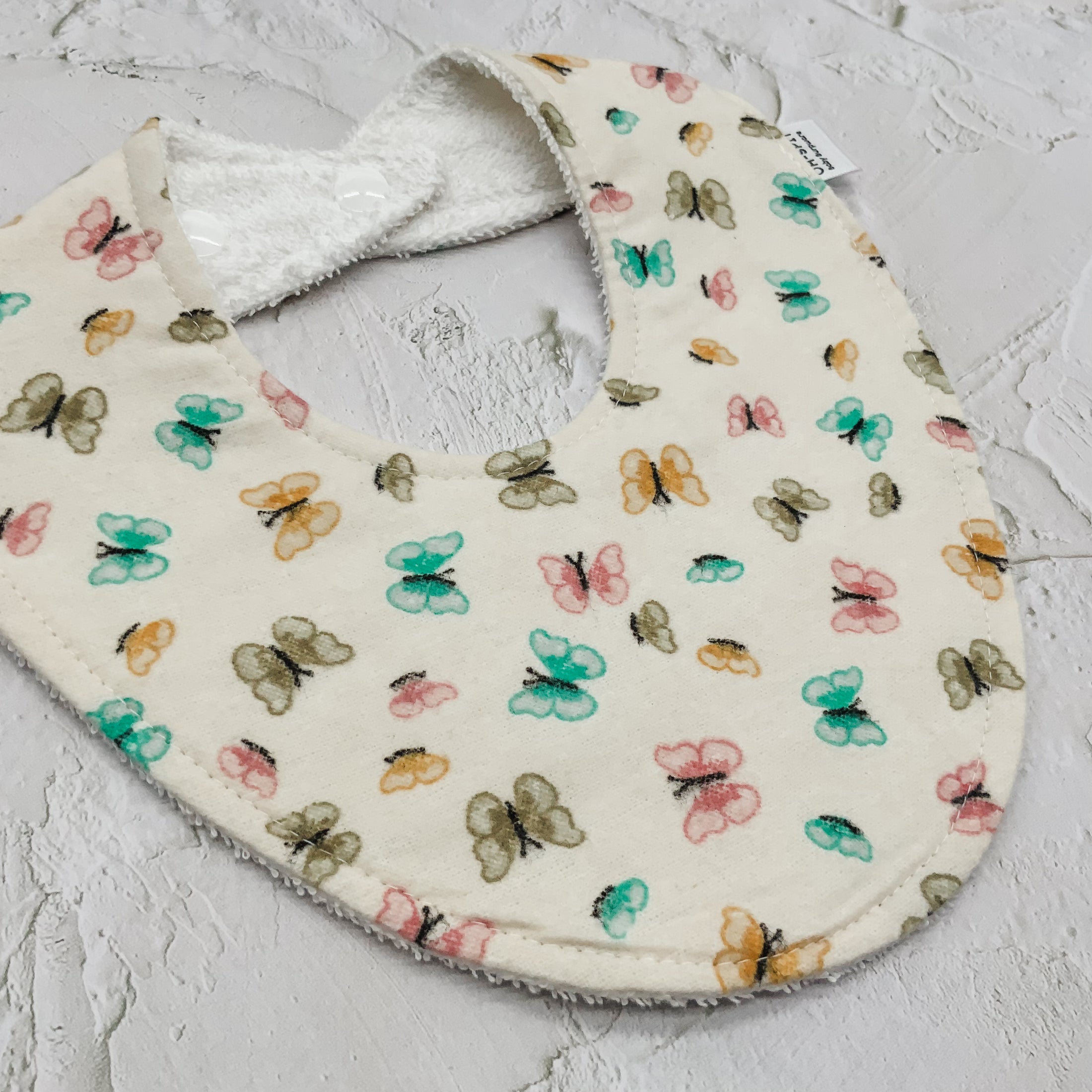 Soft Butterfly Kisses Signature Bib