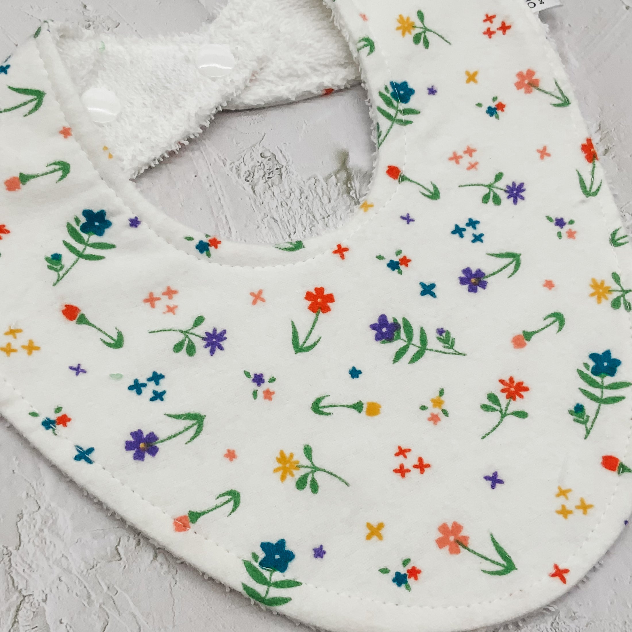 Soft Whimsical Flowers Signature Bib